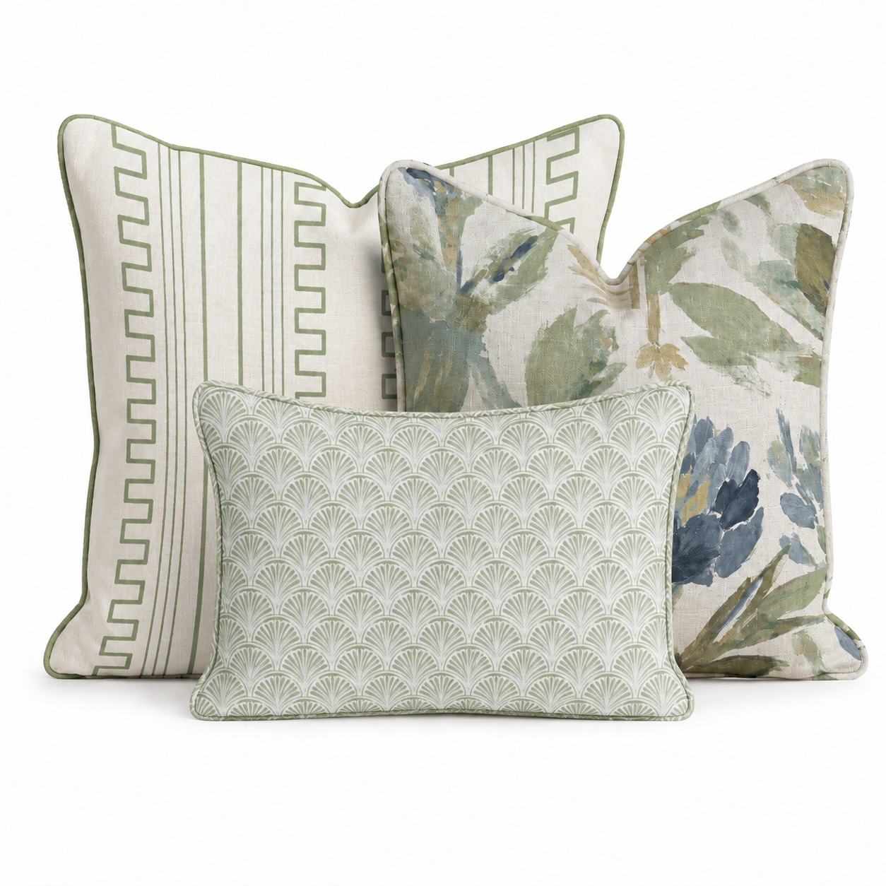 The Blue Garden Thistle Green Trio Throw Pillow Bundle by Hillcroft Home features three decorative pillows: one with green stripes and border, another with a green and blue floral pattern, and a smaller front pillow showcasing a pale green fan-inspired geometric design. All are elegantly arranged together on a white background.